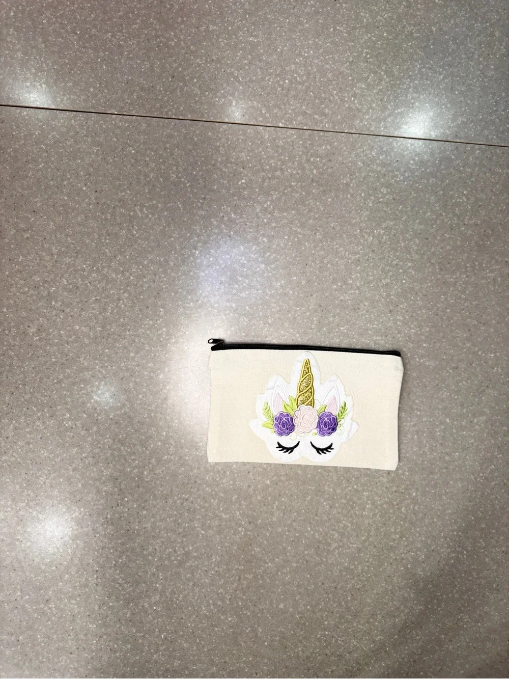 Cosmetic bag with unicorn.  Design is on both sides.  8 x 5